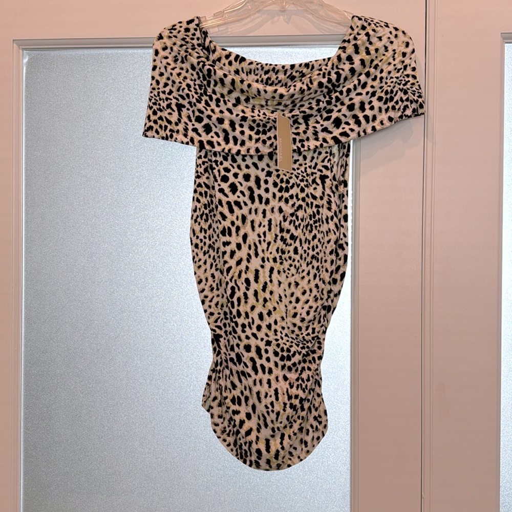 MK: Cute sleeveless, stretch. animal print, off the shoulder, Spring/Summer top.